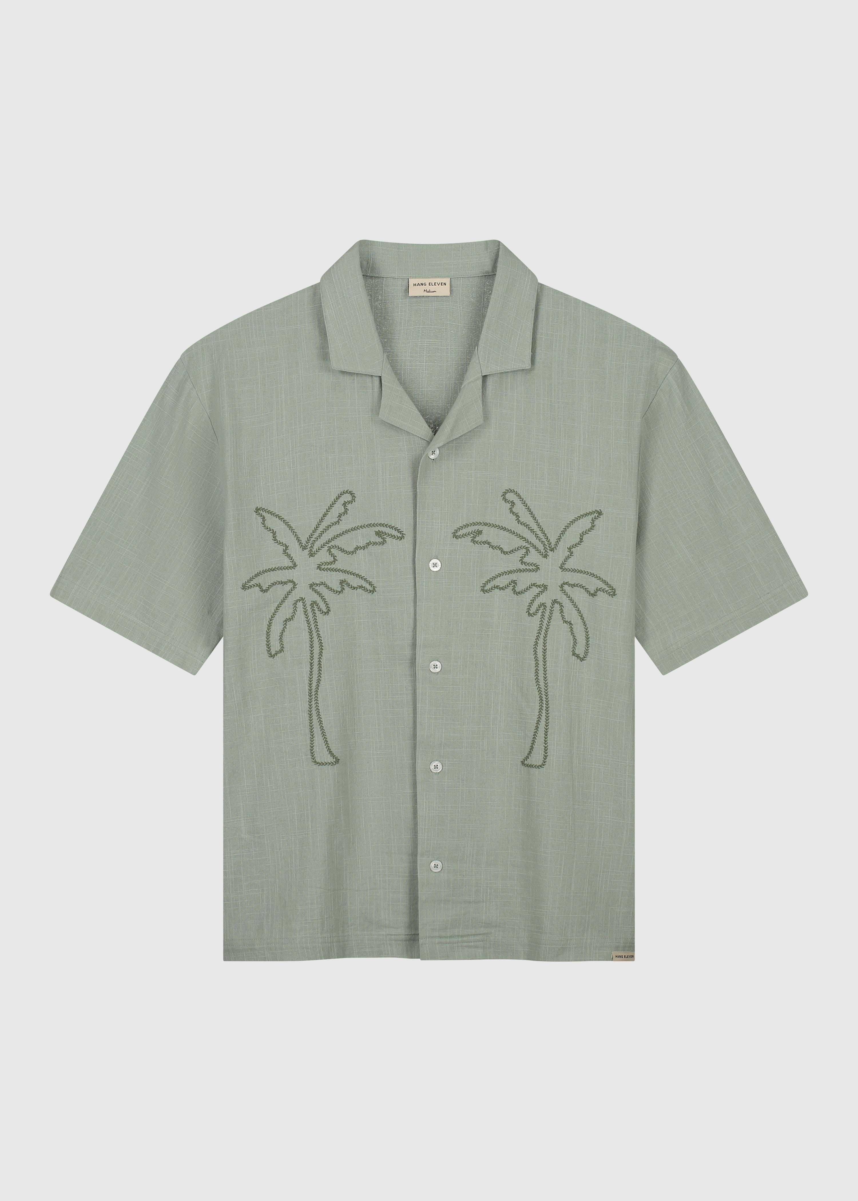 https://cdn.shopify.com/s/files/1/0641/4857/0345/files/WovenSlubPalmShirt_SageGreen_Packshot_Front.jpg?v=1744905947